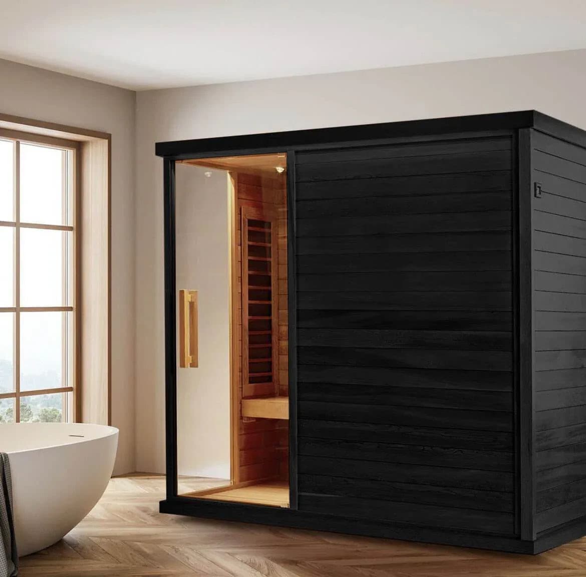 Sun Home Solstice 4-person infrared sauna in a bathroom beside a freestanding tub, door open to the eucalyptus interior